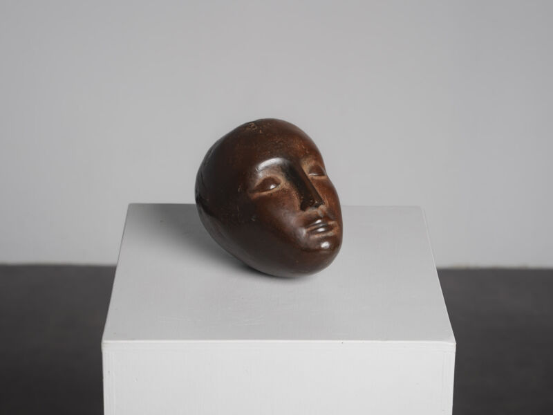 Modernist bronze sleeping head sculpture, 1960s, three-quarter front view