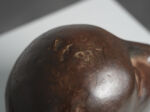 Modernist bronze sleeping head sculpture, 1960s, bronze surface and patina detail